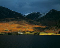 A ray of sunlight illuminates Rannerdale on a dark winter afternoon