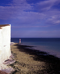 A view to the Beachy Head lighthouse under the Seven Sisters chalk cliffs
